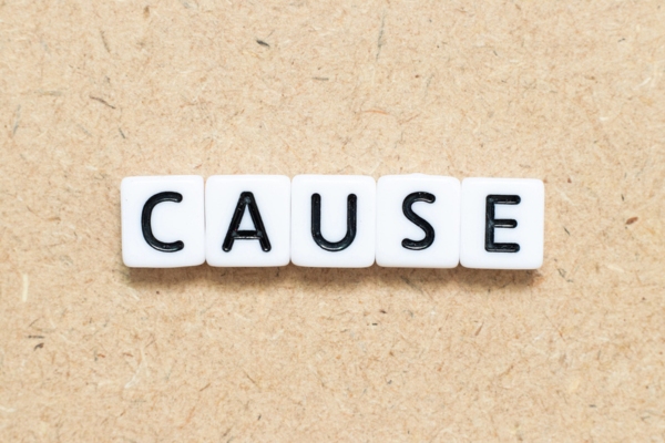 cause spelled using white plastic letter tiles depicting air conditioning refrigerant leaks