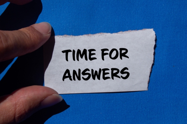 Time for answers message written on ripped torn paper depicting air conditioner tune up FAQs