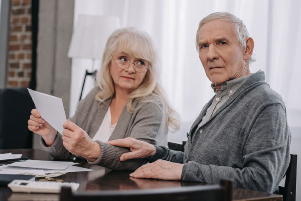 image of an elderly couple worried about home heating bills and electricity conversion