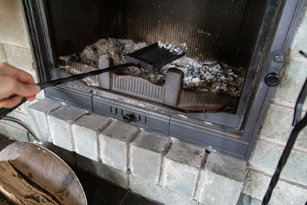 image of messy wood fireplace soot and ash