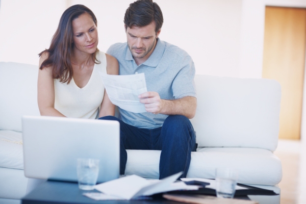 Couple deciding between ductless or centralized HVAC system