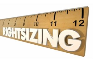 wooden ruler with rightsizing text written on it depicting proper air conditioner sizing