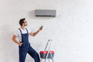 HVAC technician installing new air conditioner depiciting energy-efficiency