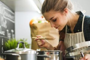 homeowner cooking with propane stove