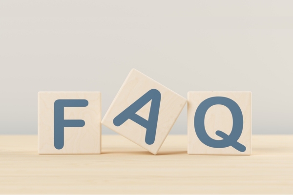 FAQ spelled using wooden cubes depicting questions about energy conservation
