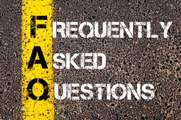 Frequently Asked Questions spray painted on concrete surface depicting FAQs about replacing air conditioner systems