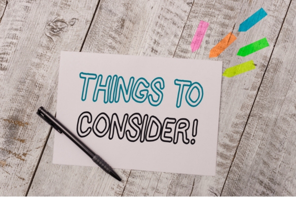 Things to consider written on paper depicting choosing home air conditioners