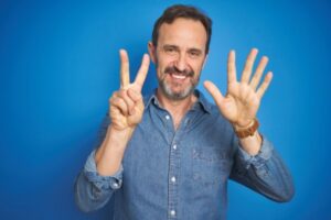 man holding 7 fingers up depicting benefits of a A Ductless Split System