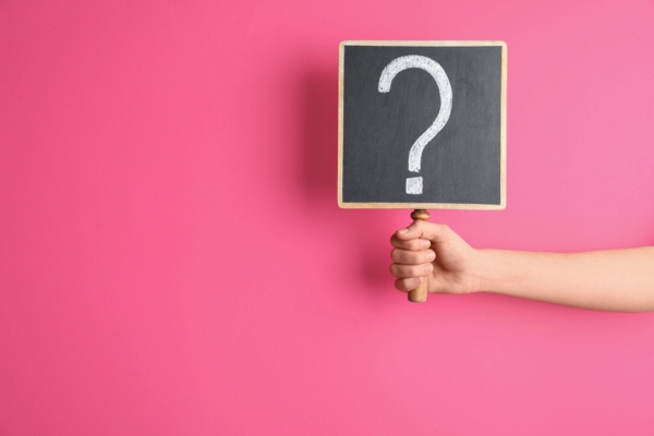 question mark sign against pink background depicting FAQS about AC Fan