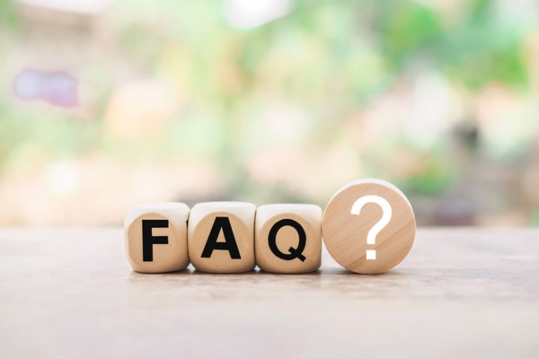FAQ spelled using wooden letter dice depicting questions about ductless air conditioning historic home
