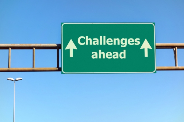 challenges ahead road sign depicting heating oil tank advancements