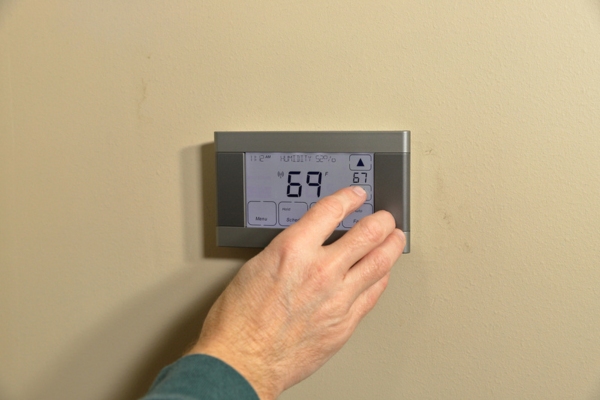 smart digital thermostat set on 69 degrees Fahrenheit