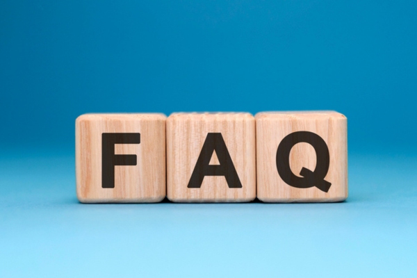 FAQ spelled using wooden letter cubes depicting Furnace vs Heat Pump questions