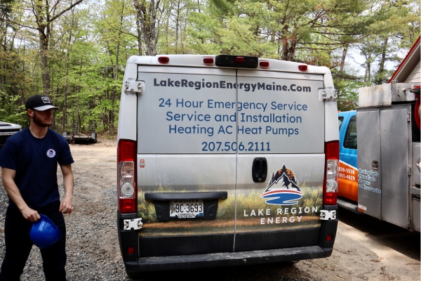 back view of Lake Region Energy service van with professional HVAC technician