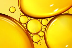 drops of gold liquid depicting heating oil