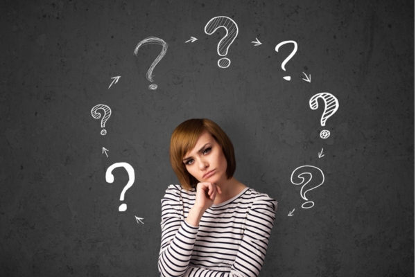 woman surrounded by question marks depicting FAQs about Propane Myths