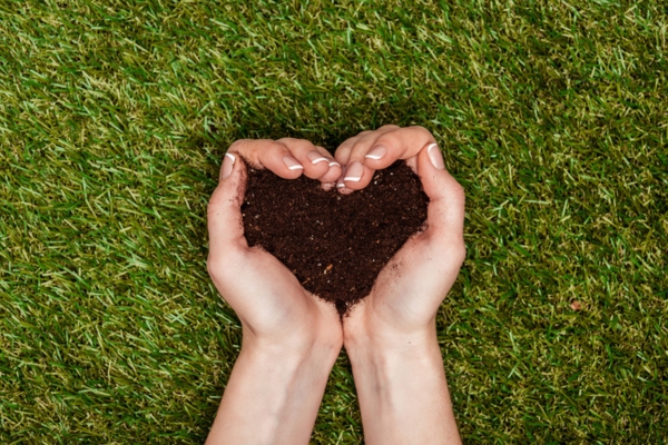 hand holding soil shaped in to a heart depicting Environmental and Safety Benefits