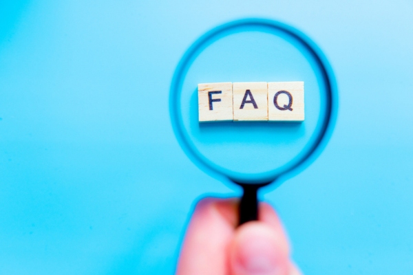 FAQ highlighted by a magnifying glass depicting Heating Oil Tank Winter Preparation questions