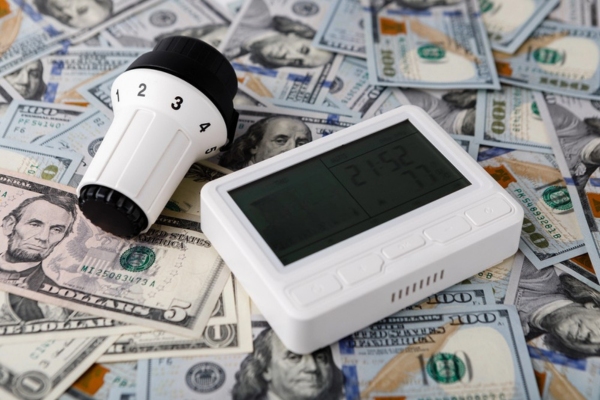 heating thermostats on top of dollar bills