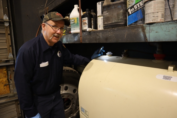 Lake Region Energy staff tending to a home oil storage tank