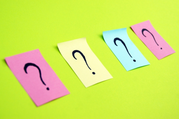 question marks written on colored sticky notes depicting FAQs About Local Heating Oil Supplier