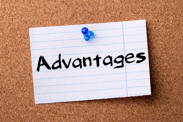 ADVANTAGES written on a torn paper pinned on a corkboard