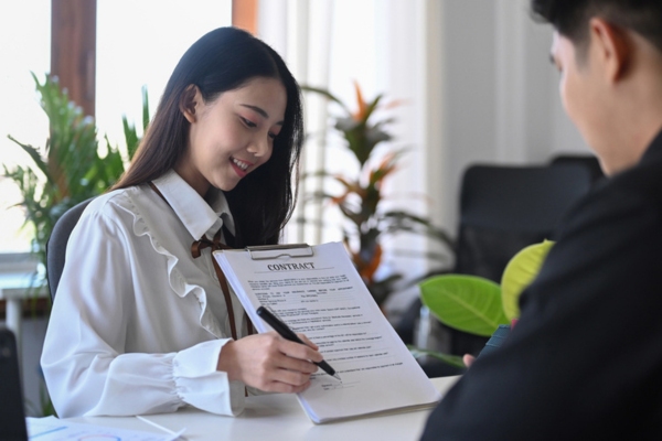 woman explaining contract details to a client