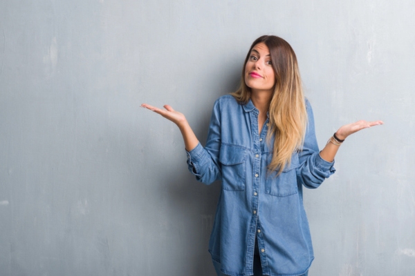 woman shrugging with both hands raised on the side asking How Often Should Your HVAC Air Filter Be Replaced