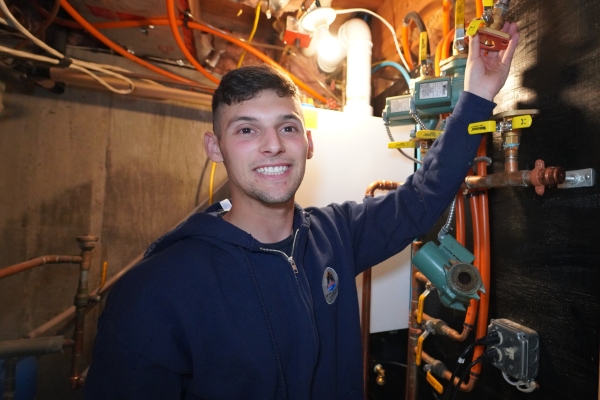 Lake Region Energy HVAC technician performing client service