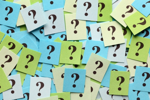 question marks on colored papers depicting Cooling System Installation FAQs