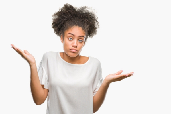 woman shrugging with both hands raised on each side depicting What Leads to Uneven Temperatures in Your Home