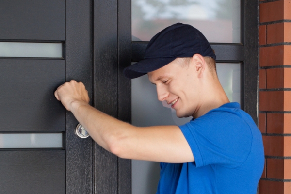 man knocking on door to offer HVAC services