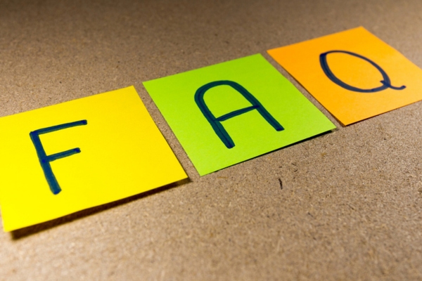 FAQ written on colored sticky notes depicting AC Blowing Weak Air questions
