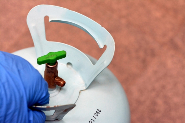 close up of a refrigerant cylinder depicting Refrigerant Leaks