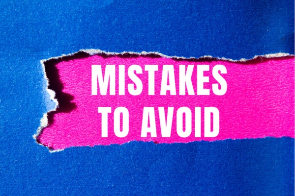 mistakes to avoid written on a pink paper revealed from torn paper on top