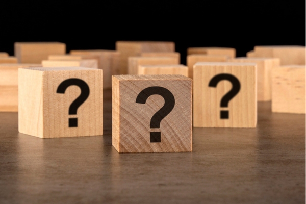 question mark on wooden cubes depicting What Temperature to Set Air Conditioner in Summer FAQs