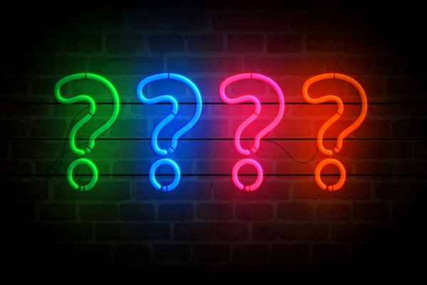 question marks formed using neon lights depicting Trusted Heating Oil FAQs