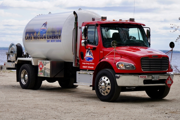 New Gloucester, ME propane delivery truck parked near a residential area by the water